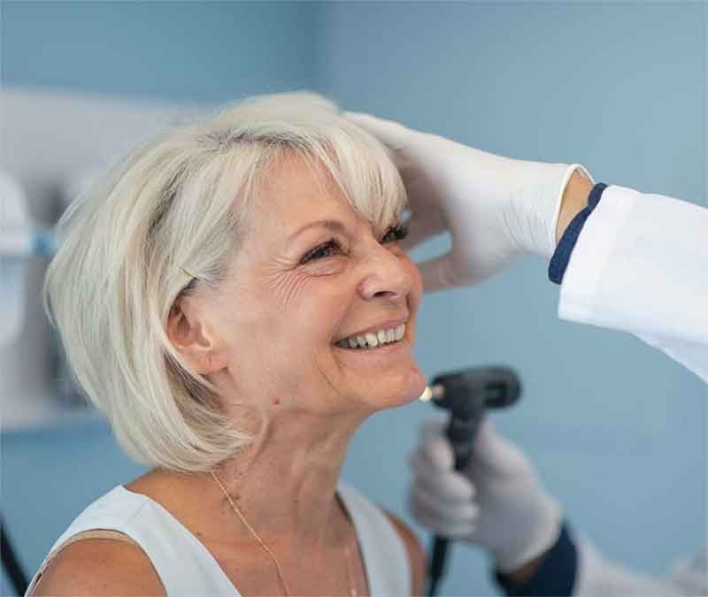 TheWebDoctor Woman getting ear examined