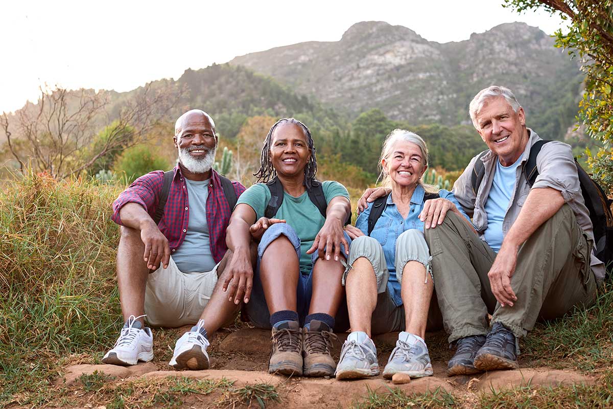 Mature group of adults resting on the trail.